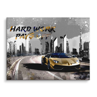 Motivationsbild mit goldenem Sportwagen vor moderner Skyline und Text 'Hard Work Pays Off'.