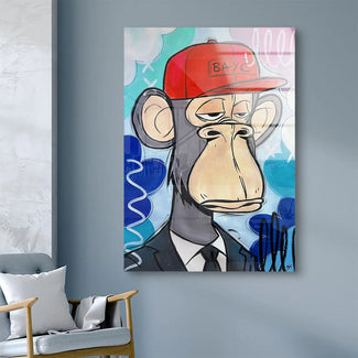 Modernes Wandbild mit Comic-Affe im Anzug und roter Kappe auf blauem Hintergrund