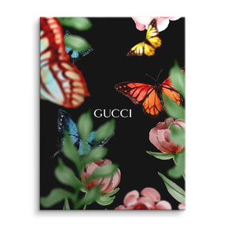 Leinwandbild mit bunten Schmetterlingen und Blüten auf schwarzem Hintergrund, Text GUCCI