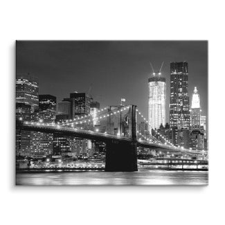 Schwarz-weiß Wandbild mit New York Skyline und Brooklyn Bridge bei Nacht auf Leinwand